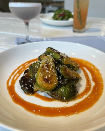 Pan seared brussels At Belse Restaurant NYC In New York City
