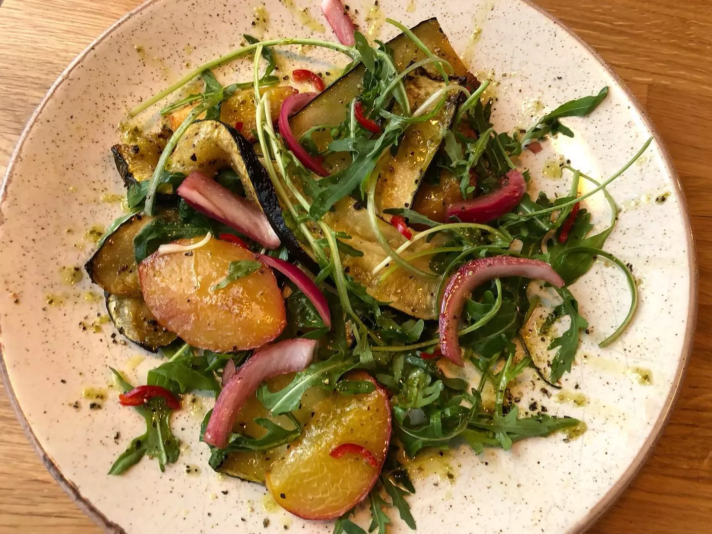 Grilled peaches & courgette w/ pickled onions, fresh chilli & lemon, garlic, parsley dressing